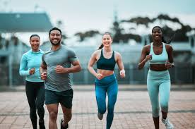 Sculpting Sleek Arms: The Essential Role of Cardio in Toning Without Bulking Up 3 image of people running to incorporate cardio Chippenham exercise into their life to help tone arms and body.